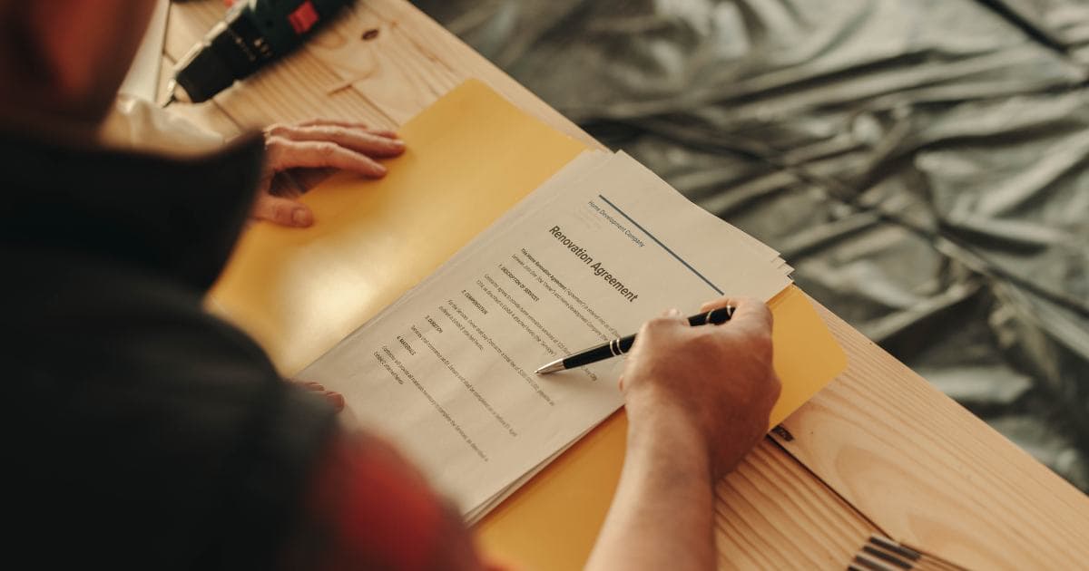 Homeowner and restoration contractor reviewing an insurance claim together
